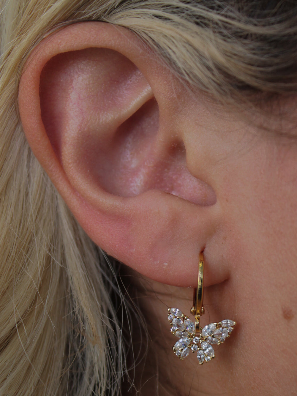 Gold butterfly huggie earrings
