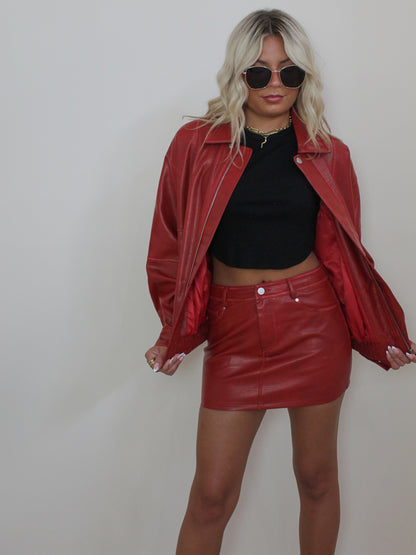 Girl wearing Faux Leather Bomber Jacket in Red