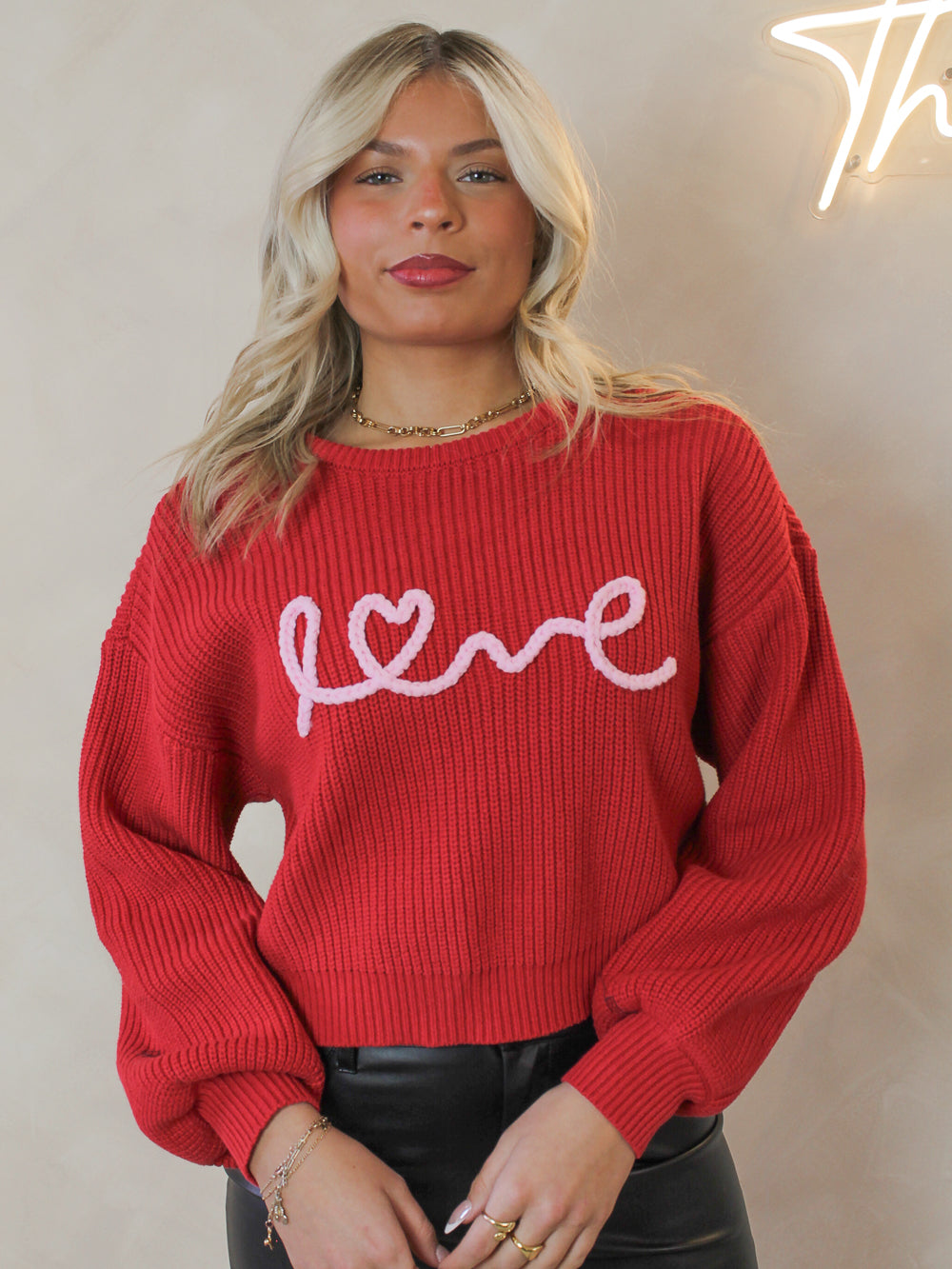 Red knit long sleeve sweater with love script detail